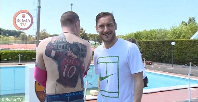 Roma legend Totti meets super fan with giant tattoo of him on his back Roma legend Totti meets super fan with giant tattoo of him on his back