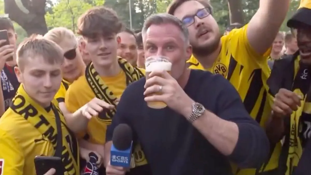 Jamie Carragher Downs Beer On Live TV After Being Egged On By Dortmund fans Jamie Carragher Downs Beer On Live TV After Being Egged On By Dortmund fans